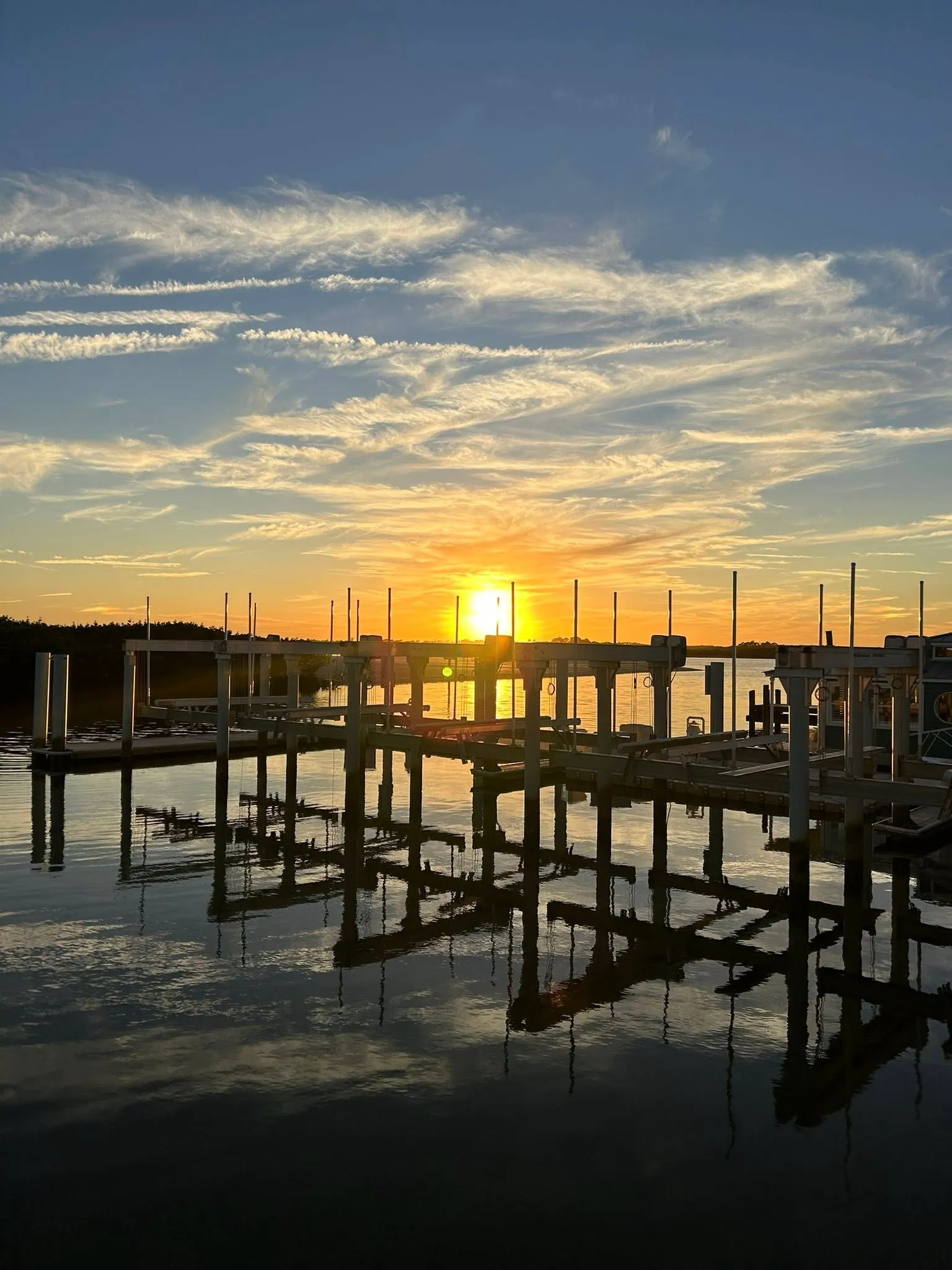 Sunrise over the waterfront docks near HT's Sand Bar & Bistro